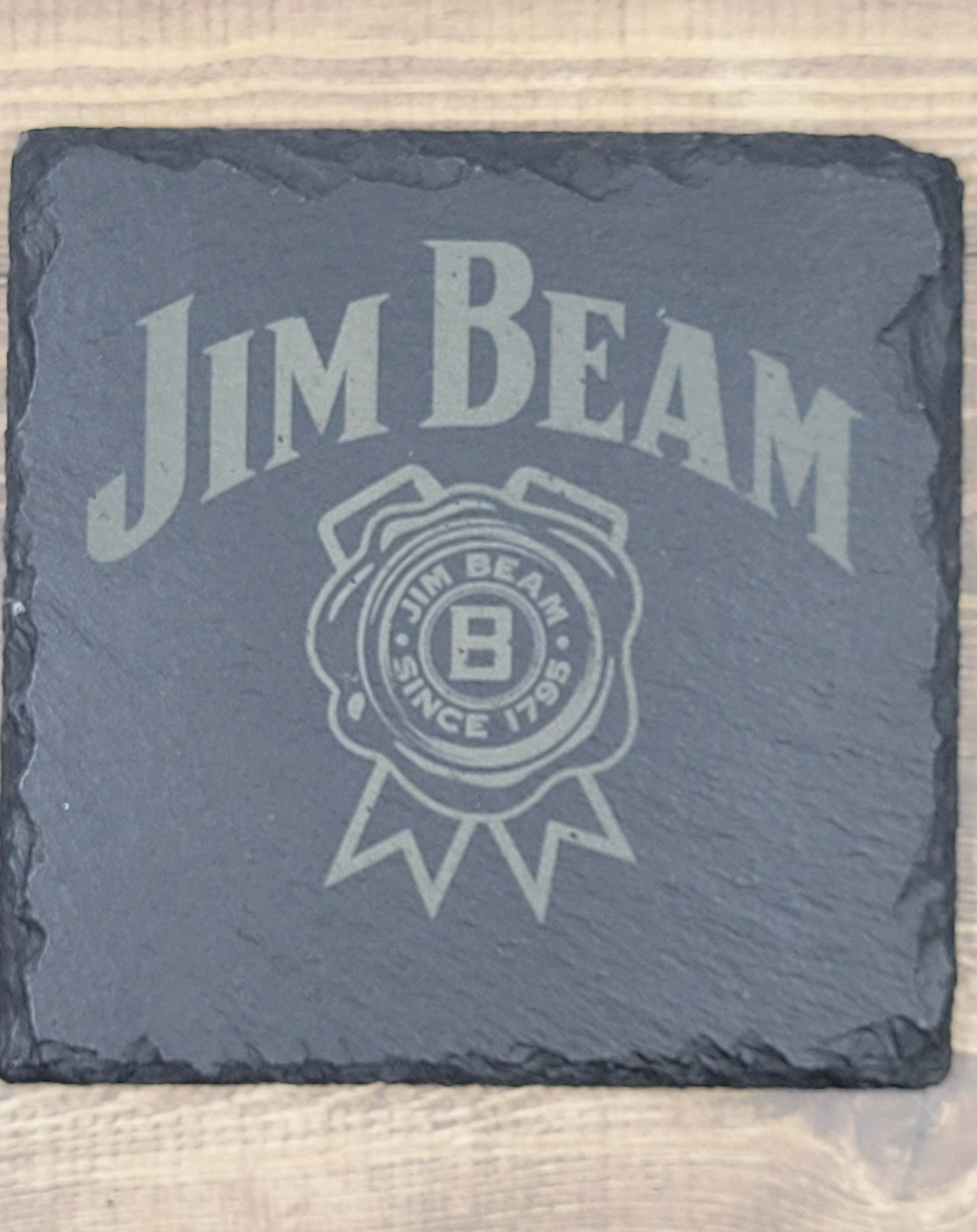 Jim Beam Natural Slate Coaster These slate coasters will make a great addition to anyplace from your bar to your coffee table. These are actual stone slate measuring approximately 4" x 4". Each coaster will have 4 foam padded feet.