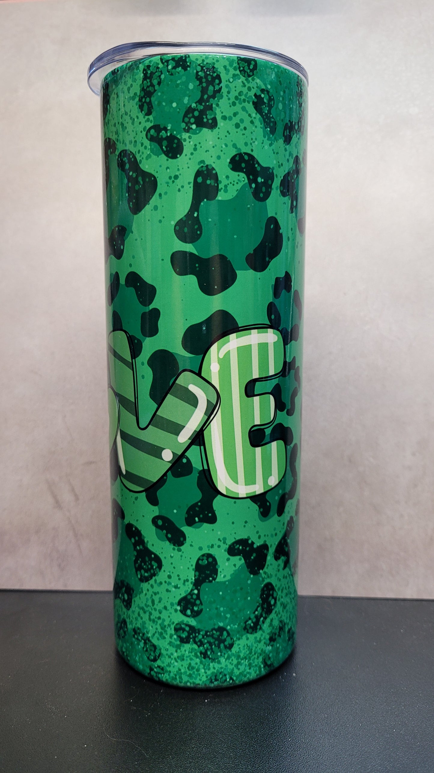 This 20 oz tumbler features a charming Love Gnome design on a stylish green cheetah print background.