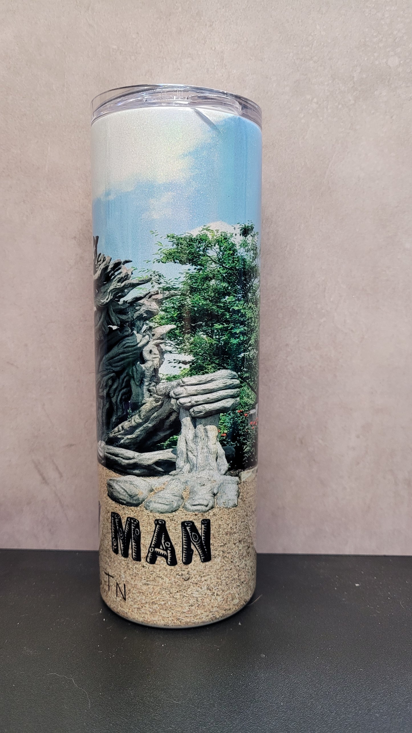 Willow Man....Gatlinburg TN....an absolute must see. I snapped this photo of him while on vacation and just had to share him with all that have not had the chance to stand before him. Some may see a guardian spirit watching over the mountains, while others interpret it as a representation of the delicate balance between humanity and the environment
