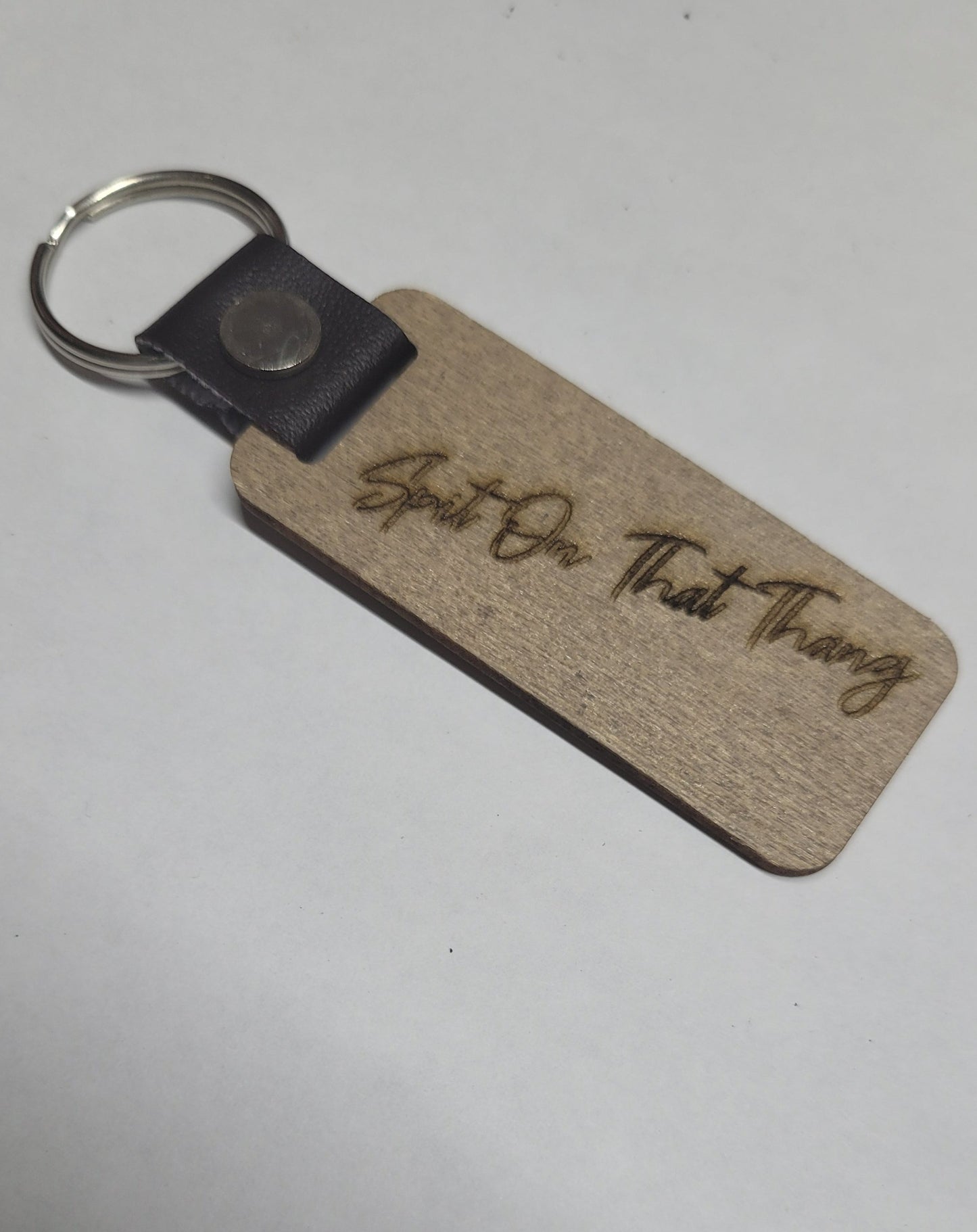 This Laser Engraved wood key chain sports the latest phrase.... Hawk Tuah. This on the front and Spit on That Thang on the back. For a fun novelty gift.... a must have
