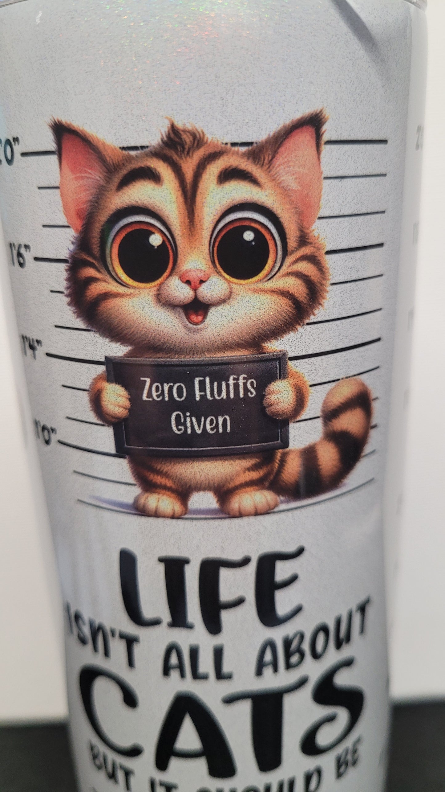 Life isn't all about cats.... but it should be. Ask any cat....it will tell you!. This comical and cute cat theme shows mug shots of various cats holding funny signs and really pops on our holographic 20 oz tumbler. Enjoy your favorite hot or cold beverage on the go and show off your style as you keep your drinks at the perfect temperature.