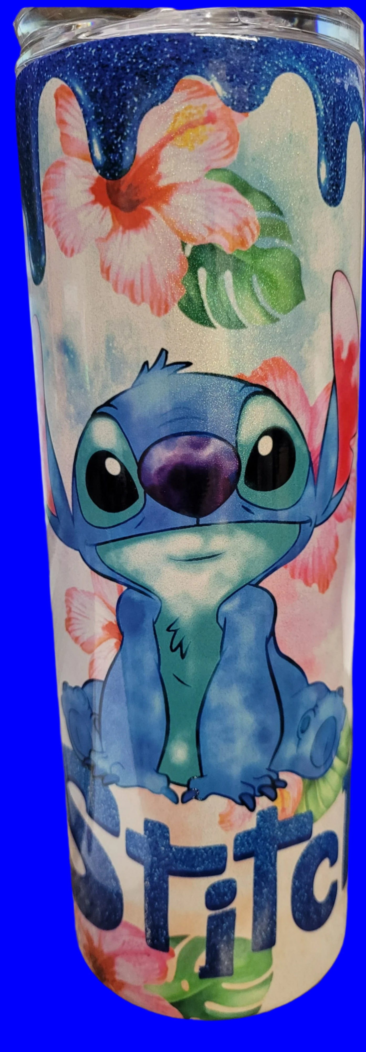 A 20 oz Stainless tumbler with a blue drip design featuring the character Stitch from the movie Lilo & Stitch.