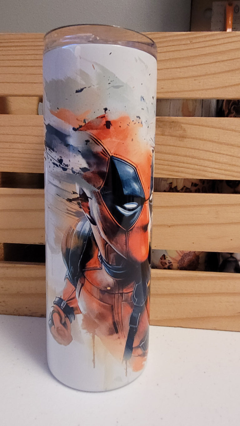 Deadpool & Wolverine...together finally! Here is a watercolor image of the pair. This 20 oz tumbler from Makerflo is made of a stainless steel double-wall construction and is vacuum insulated, with a clear sliding classic lid and a clear straw, and is BPA free. It is capable of retaining cold temperatures for 24+ hours or warm temperatures for up to 8 hours.