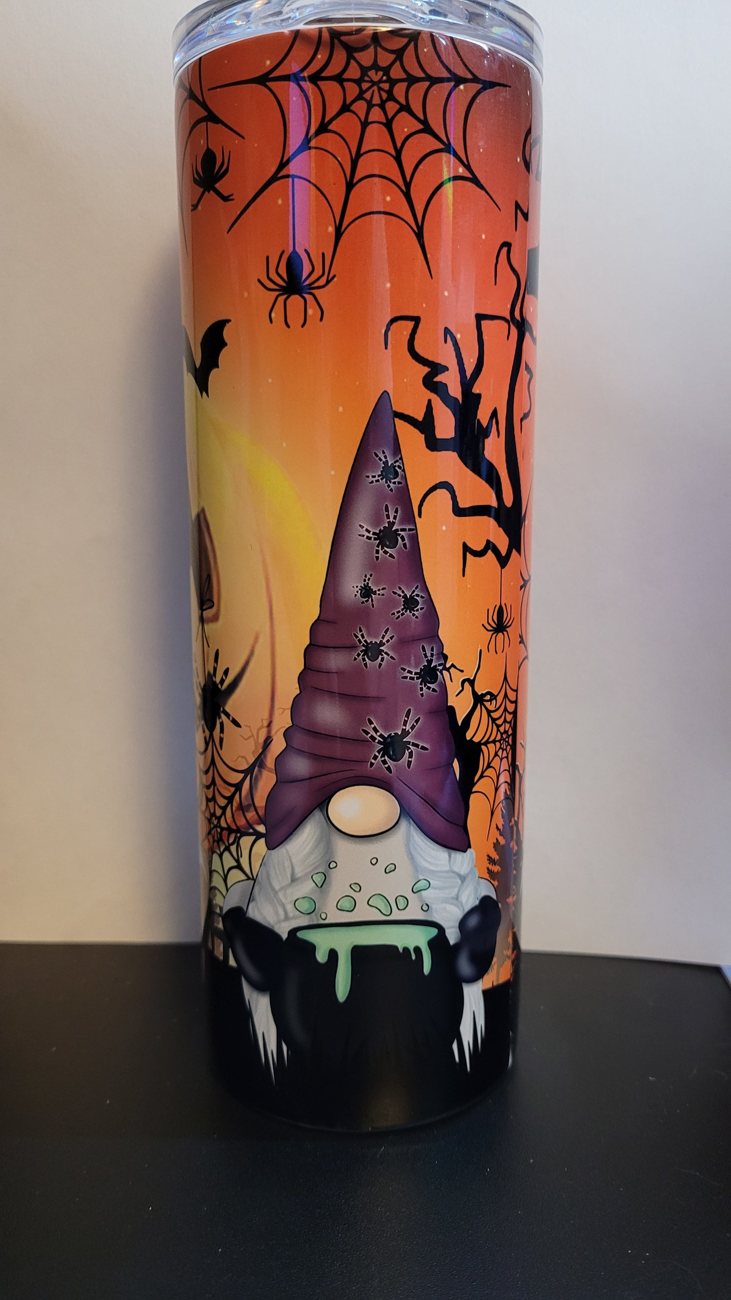 Conquer the pumpkin patch with 3 fearless gnomes and a formidable giant jack o lantern lurking behind them! Defy the odds and embrace the thrill with every sip. This is a stainless tumbler that mirrors our glass can tumbler version. This 20 oz Tumbler from Makerflo is double walled from stainless with great insulating properties.