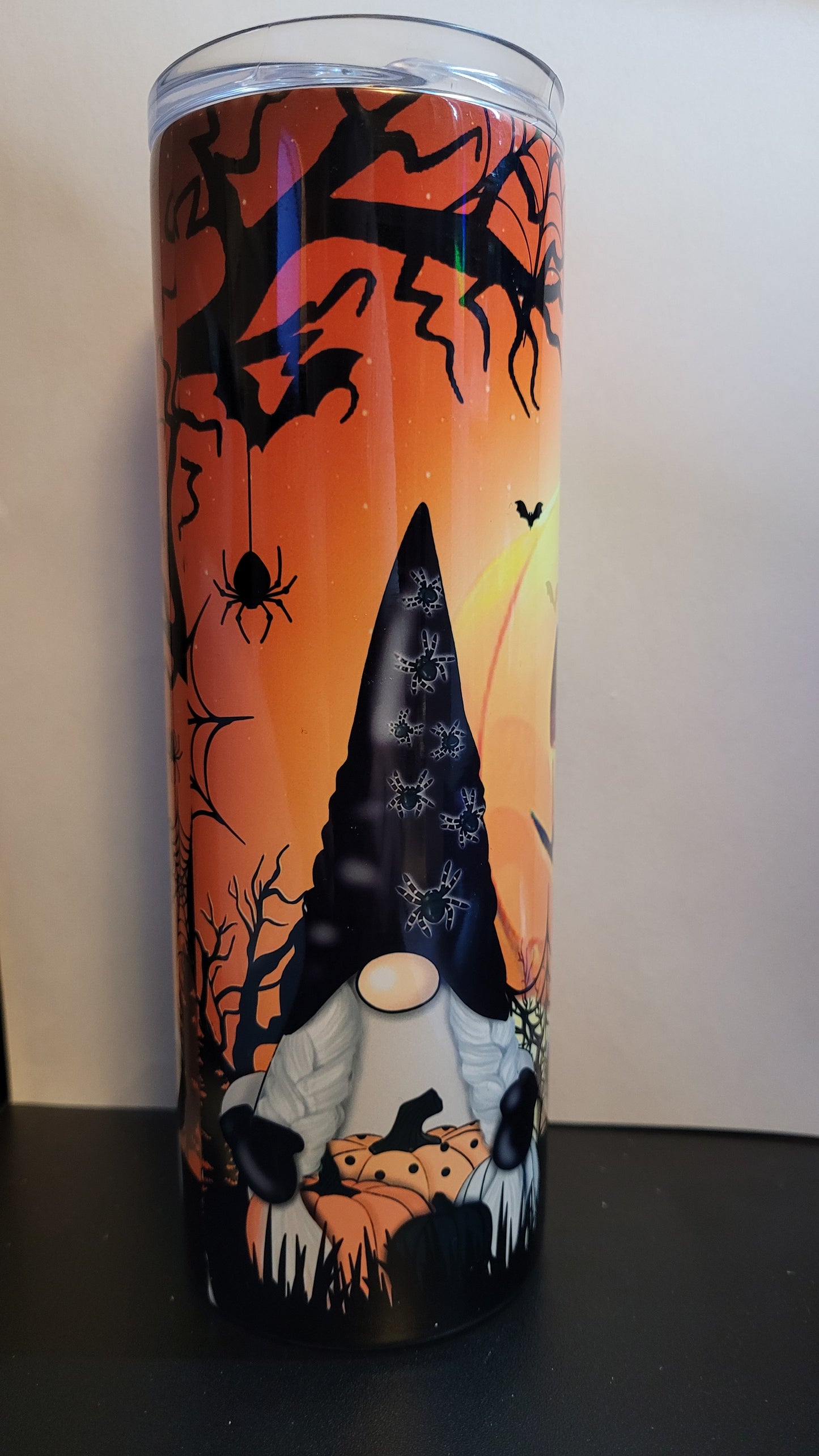 Conquer the pumpkin patch with 3 fearless gnomes and a formidable giant jack o lantern lurking behind them! Defy the odds and embrace the thrill with every sip. This is a stainless tumbler that mirrors our glass can tumbler version. This 20 oz Tumbler from Makerflo is double walled from stainless with great insulating properties.