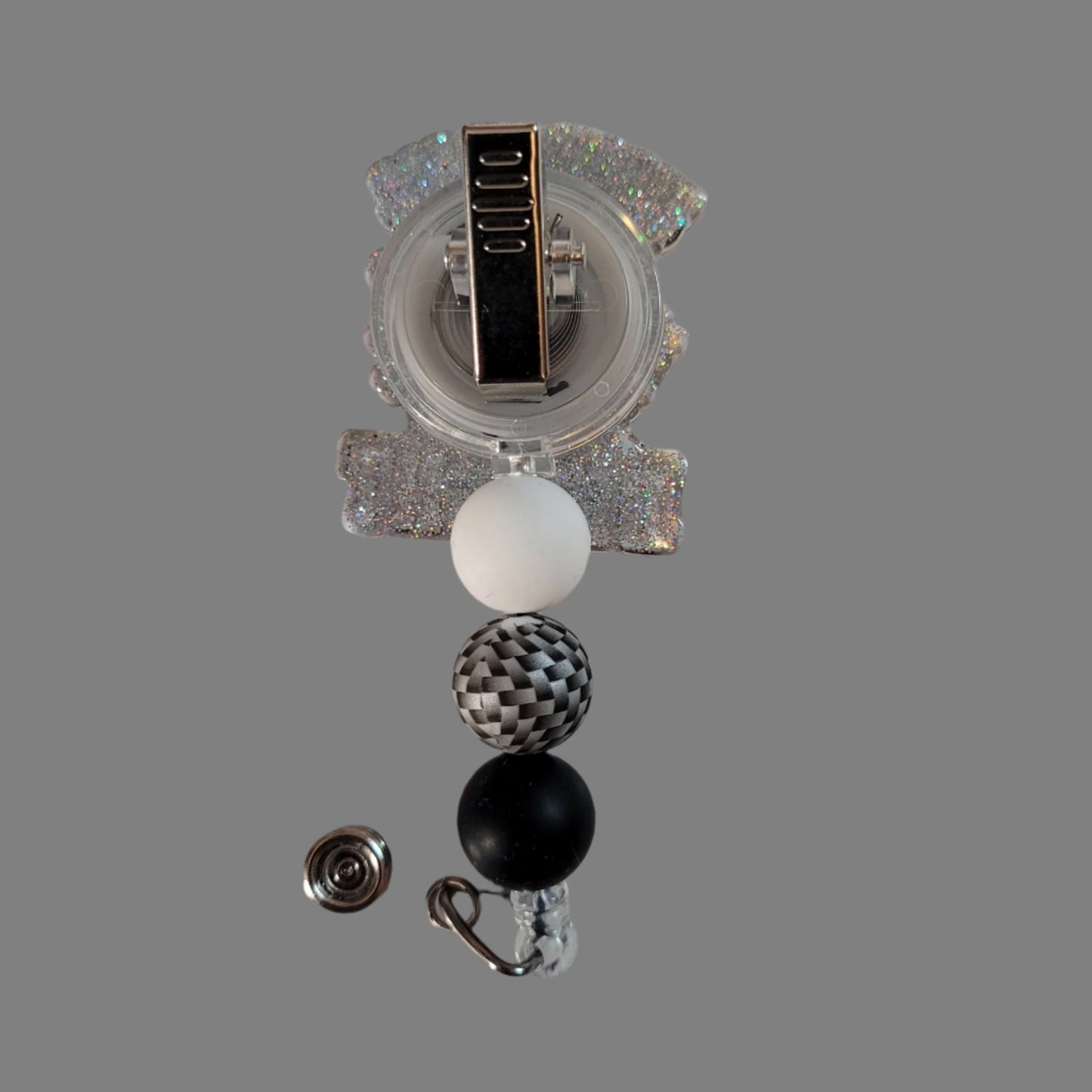 Decorative badge reel with colorful beads on a white background