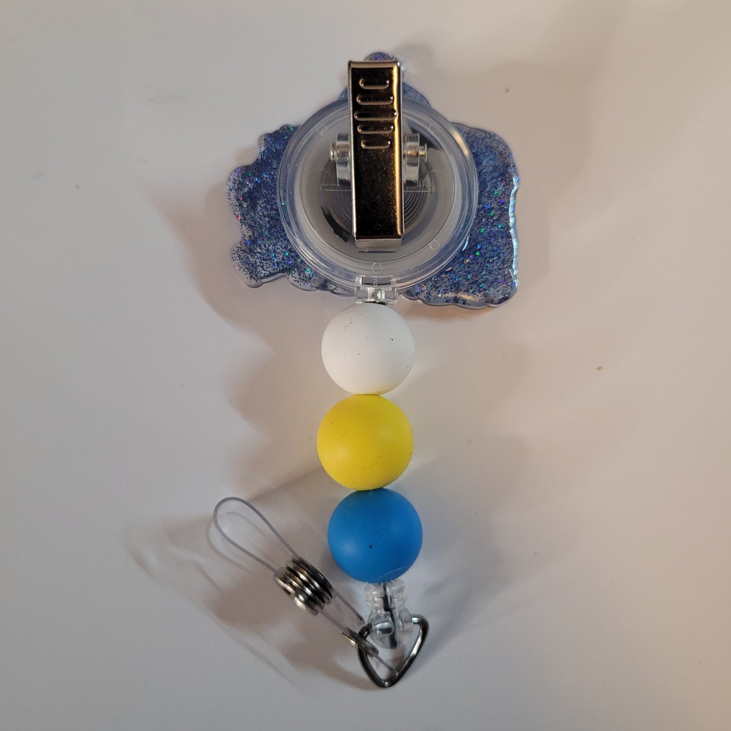 Badge holder with colorful beads on a white background