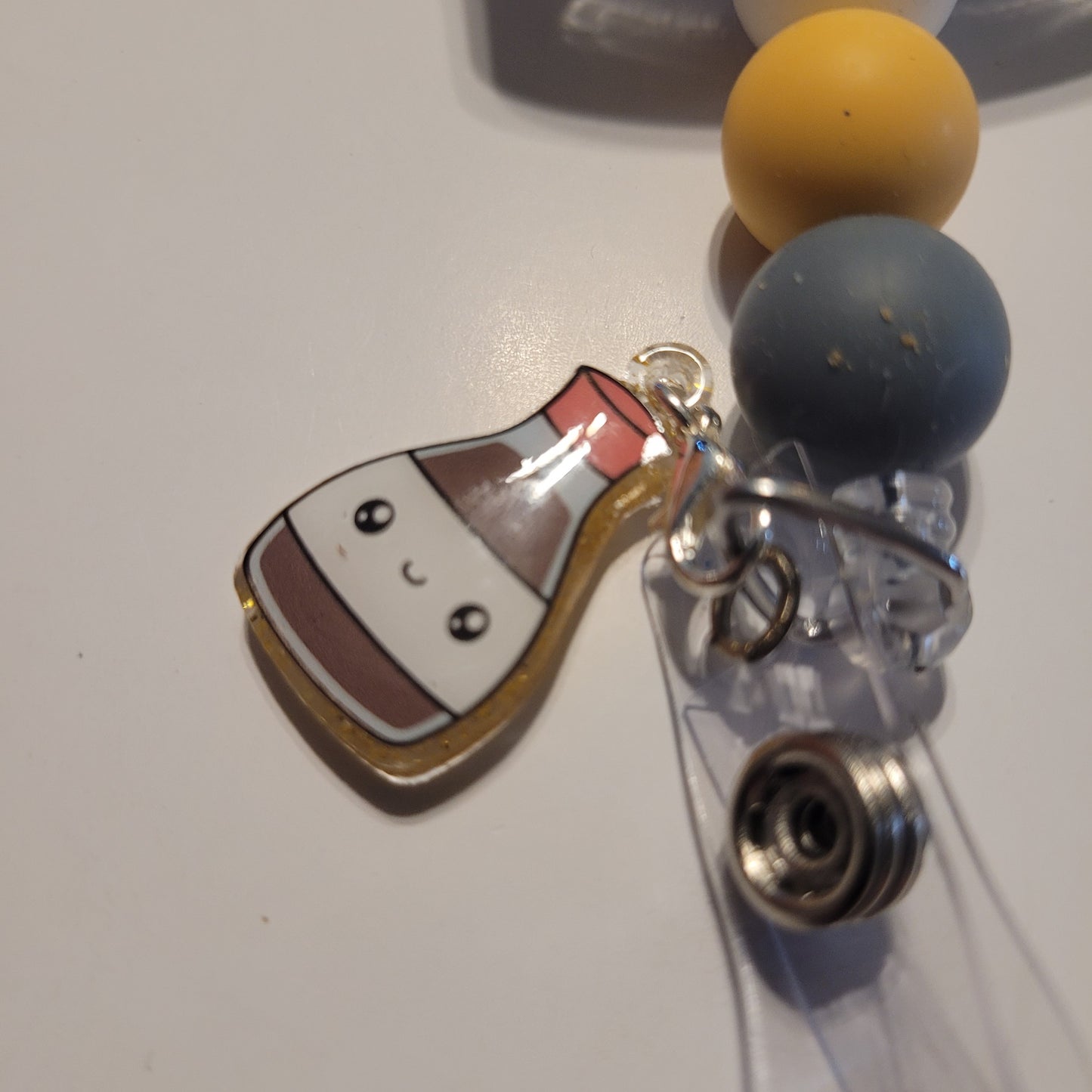 Keychain with a cartoon character charm on a white background