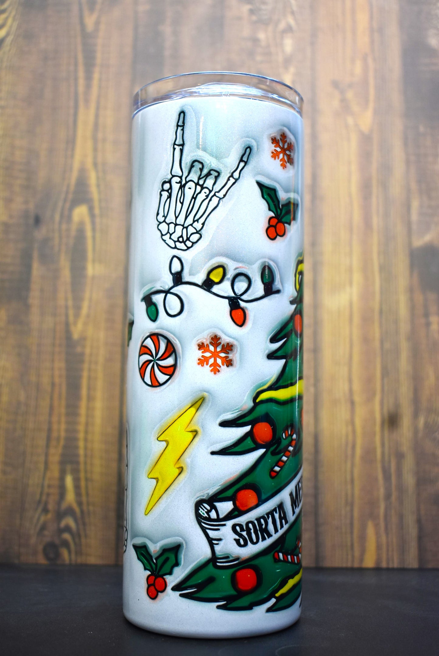 A unique 3-D printed design of half-skeleton, half-Christmas tree adorns this Makerflo 20oz stainless steel, double-wall vacuum insulated tumbler.