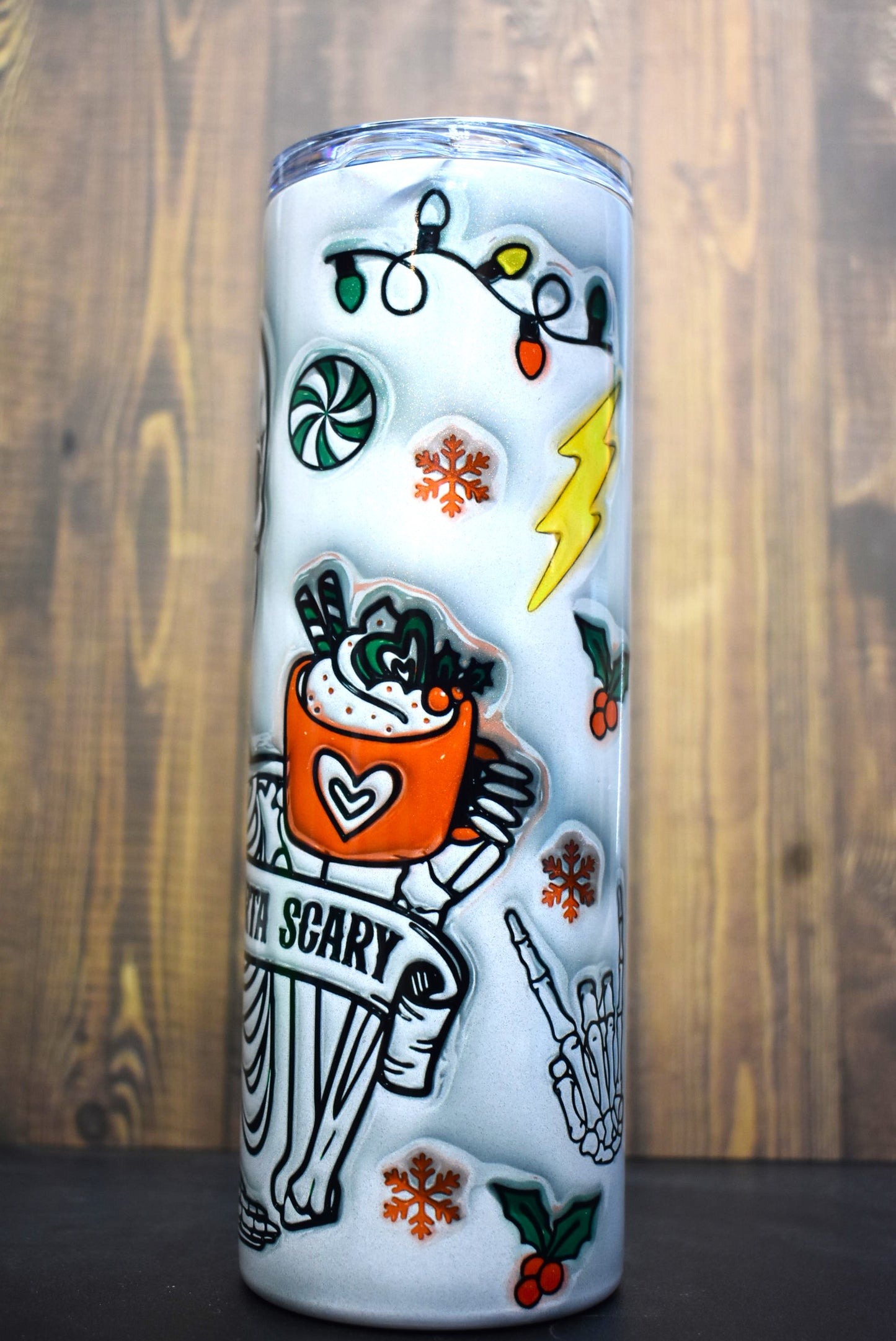 A unique 3-D printed design of half-skeleton, half-Christmas tree adorns this Makerflo 20oz stainless steel, double-wall vacuum insulated tumbler.
