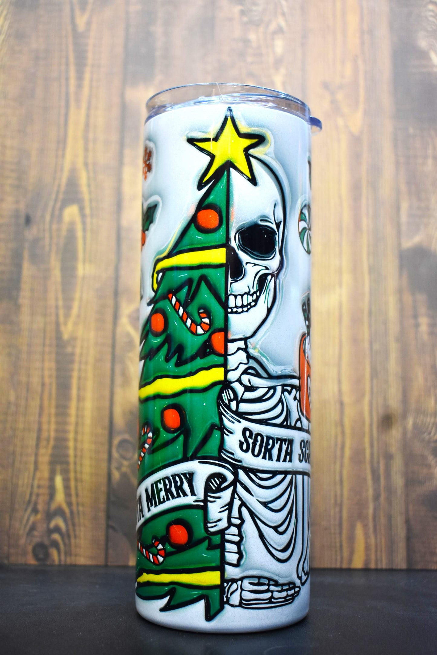 A unique 3-D printed design of half-skeleton, half-Christmas tree adorns this Makerflo 20oz stainless steel, double-wall vacuum insulated tumbler.