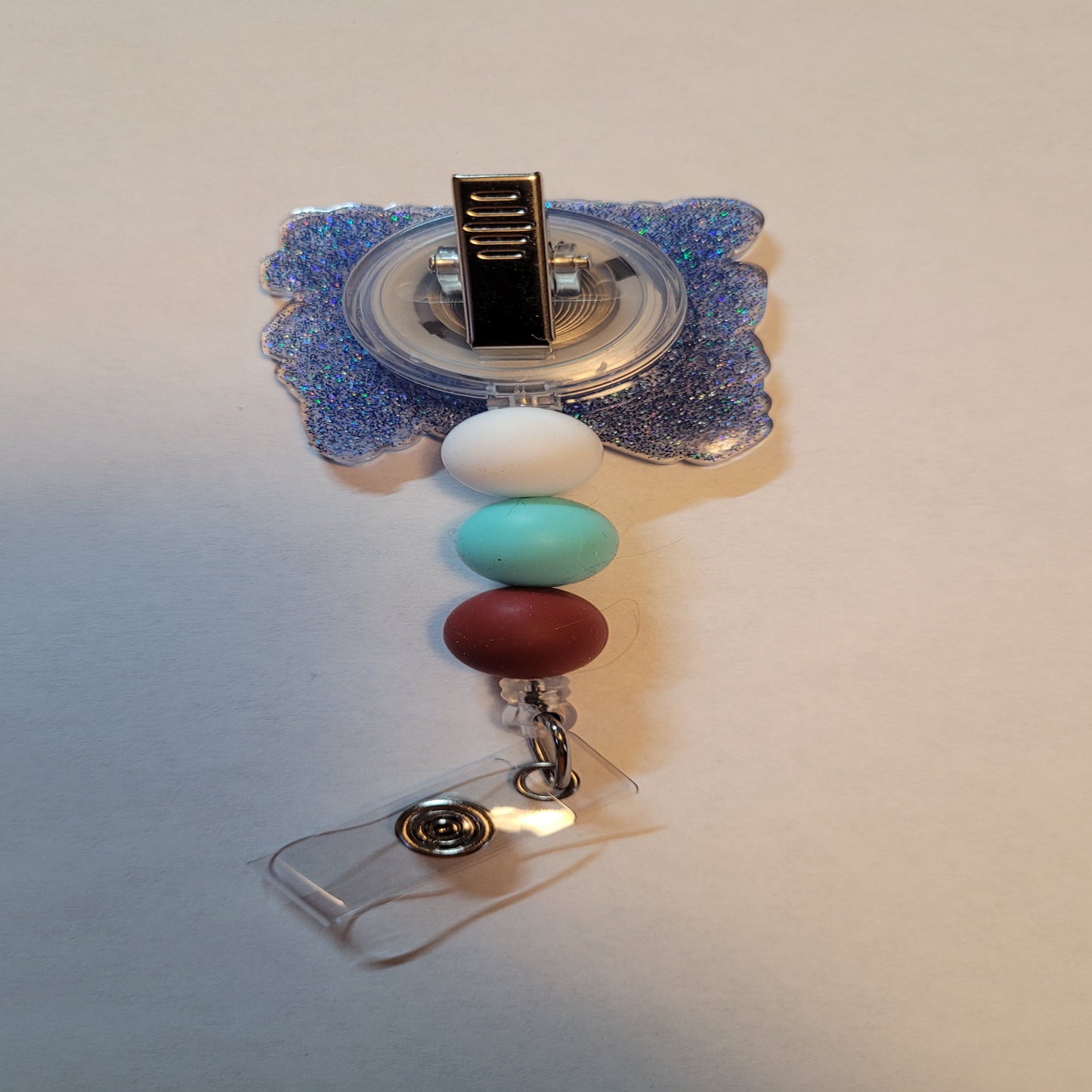 Don't forget the importance of Medical Billing & Coding in the medical team! This acrylic badge reel showcases the department perfectly with a Light Blue glitter base and matching beads for a polished finish.