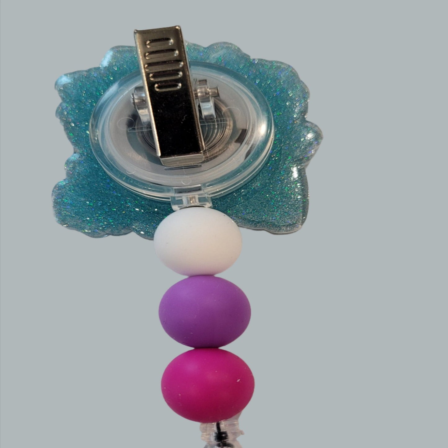 What a great moto to live by with this acrylic badge reel. Kindness Is Free Sprinkle That Stuff Everywhere. It's amazing how 1 simple act can change the day of someone for the better. This badge reel has a light blur glitter back and 3 silicone matching beads to finish the look.