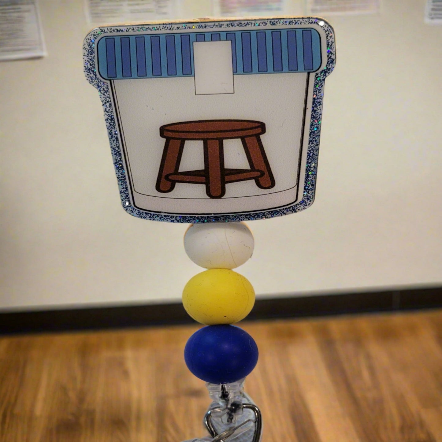Part of our latest collection of Medical Badge Reels available now, we will need this filled for the Stool Sample Badge Reel. Featuring a stool and a light blue glitter base adorned with coordinating beads, this Badge Reel is sure to catch....well we will leave that alone.