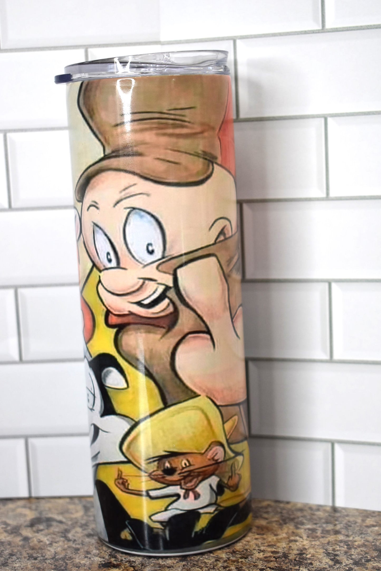 This 20oz Stainless Steel tumbler features an unfiltered adult finger salute from your childhood Looney Tunes favorites including Elmer Fudd and Yosemite Sam. It is made of a stainless steel double-wall and is vacuum insulated, with a clear sliding classic lid and a clear straw, and is BPA free.