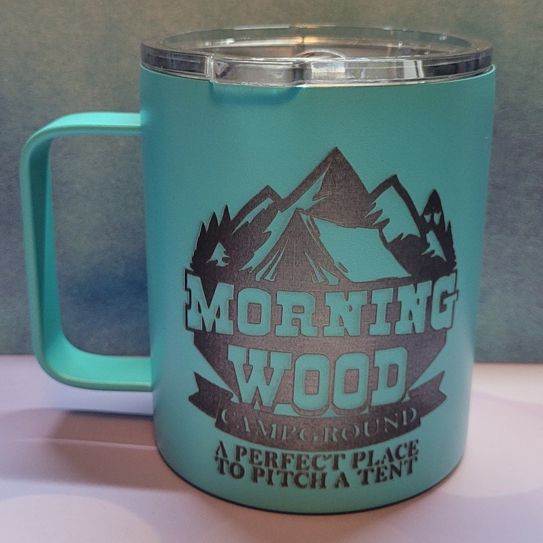 Like camping? Coffee while camping? Well enjoy a cup in our new Morning Wood Campgrounds Laser Engraved stainless coffee mug. A perfect place to pitch a tent!
This is a 12 oz mug with lid in teal.