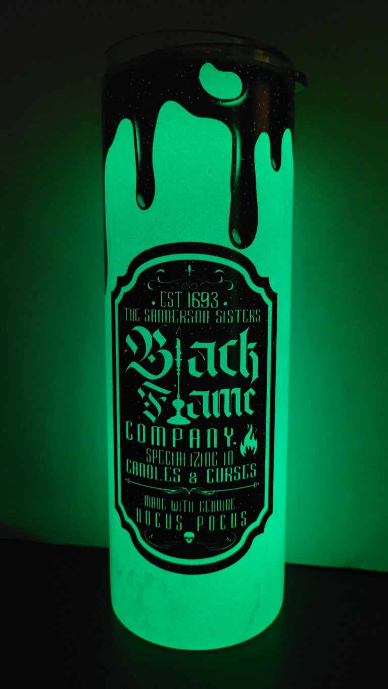 The Black Flame Company established in 1693 and specializing in Candles & Curses. Say What! Features an all black image with the classic drip look. Made with Genuine Hocus Pocus, this tumbler is a sure Halloween favorite. We kicked this one up a notch and put it on our Green Glow in the Dark!