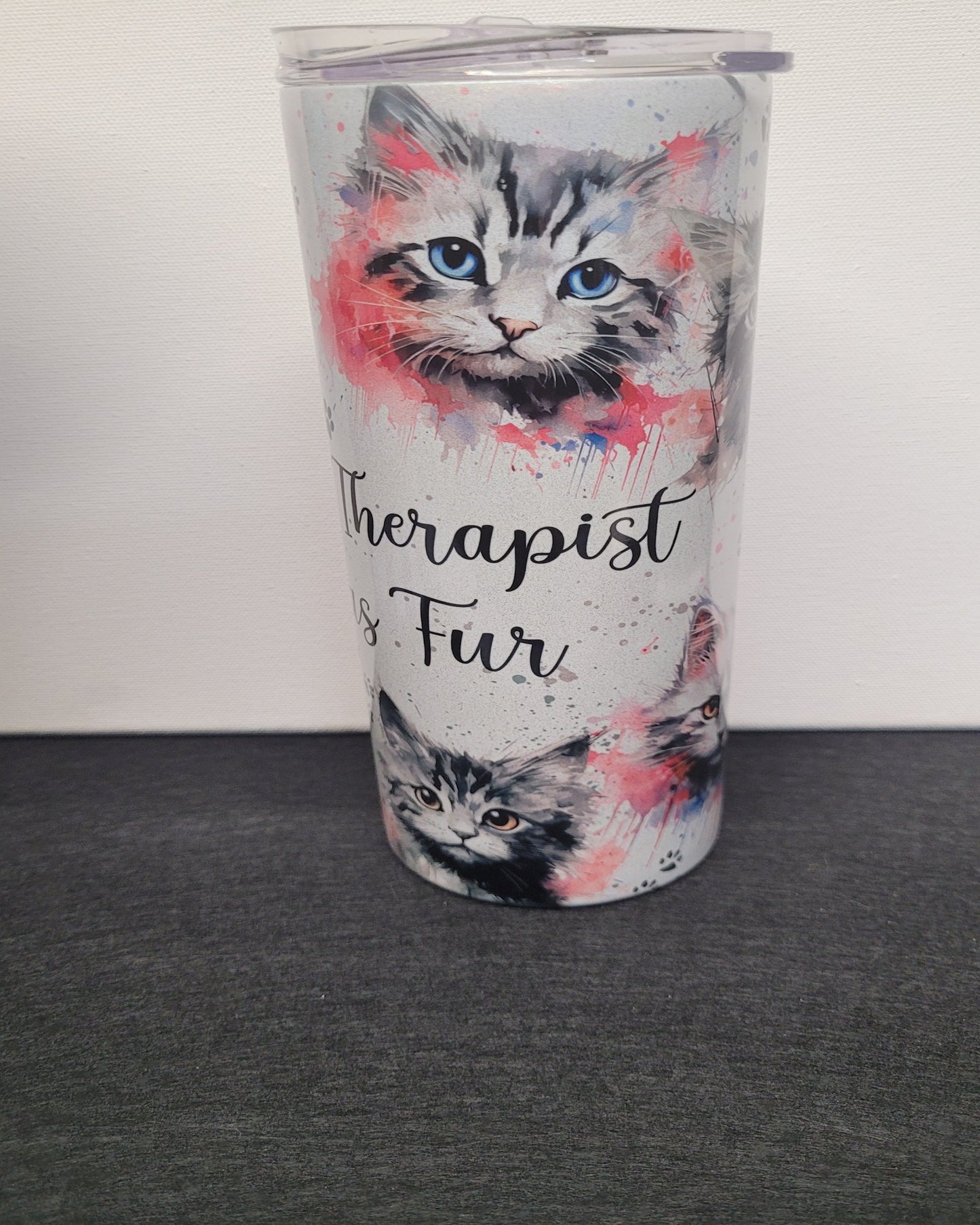 My Therapist Has Fur. This gorgeous tumbler has that phrase with various cute cat pics that will melt your heart and and stress you have. Enjoy your favorite hot or cold beverage on the go and show off your style as you keep your drinks at the perfect temperature.