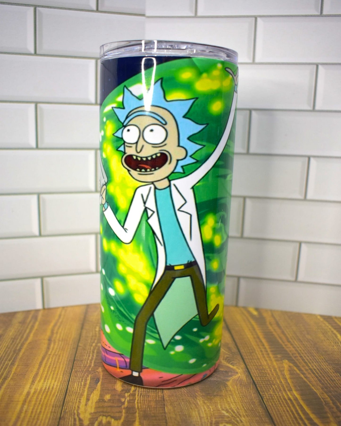 This 20oz Stainless Steel tumbler features a vivid depiction of Rick and Morty, one of the most popular sci-fi animated series of our time.