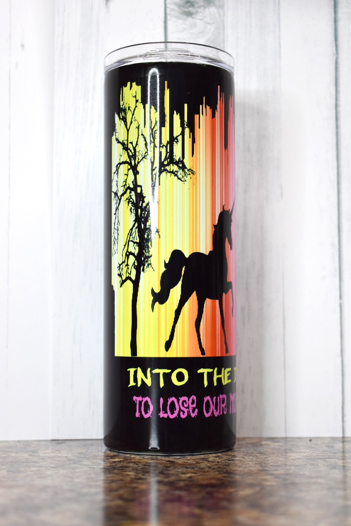 Into The Darkness We Go To Lose Our Minds & Find Our Souls. This colorful 20 oz tumbler depicts an alien, Unicorn and Bigfoot....I want to Believe...
