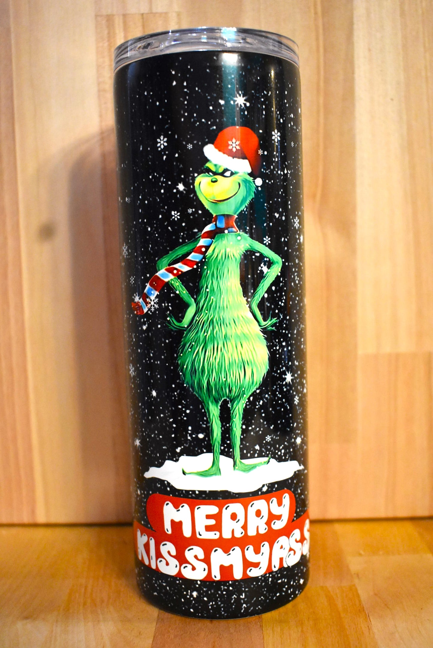 The classic Grinch design graces both sides of this 20oz stainless steel tumbler, featuring a grumpy middle finger on one side and a Merry Kissmyass on the other. Double-wall vacuum insulation ensures that beverages stay cold for 24+ hours and warm for 8 hours, with a sliding BPA-FREE lid and clear straw to complete the look. Share it with the special Bah Humbug person in your life.