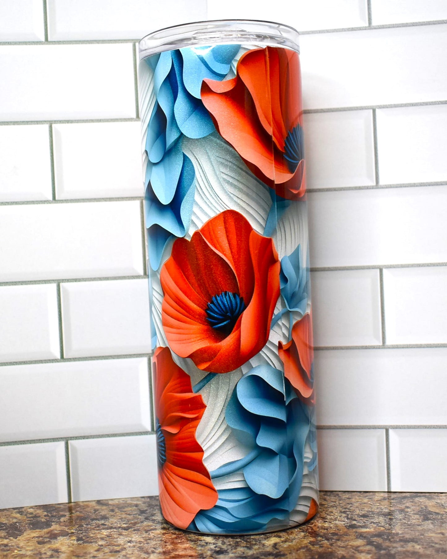 Red Poppies on a white and blue background in 3D are popping all over this tumbler. This Makerflo 20 oz tumbler is made of high-quality stainless steel construction and sweat-resistant design ensures your favorite drinks stay cool for longer.