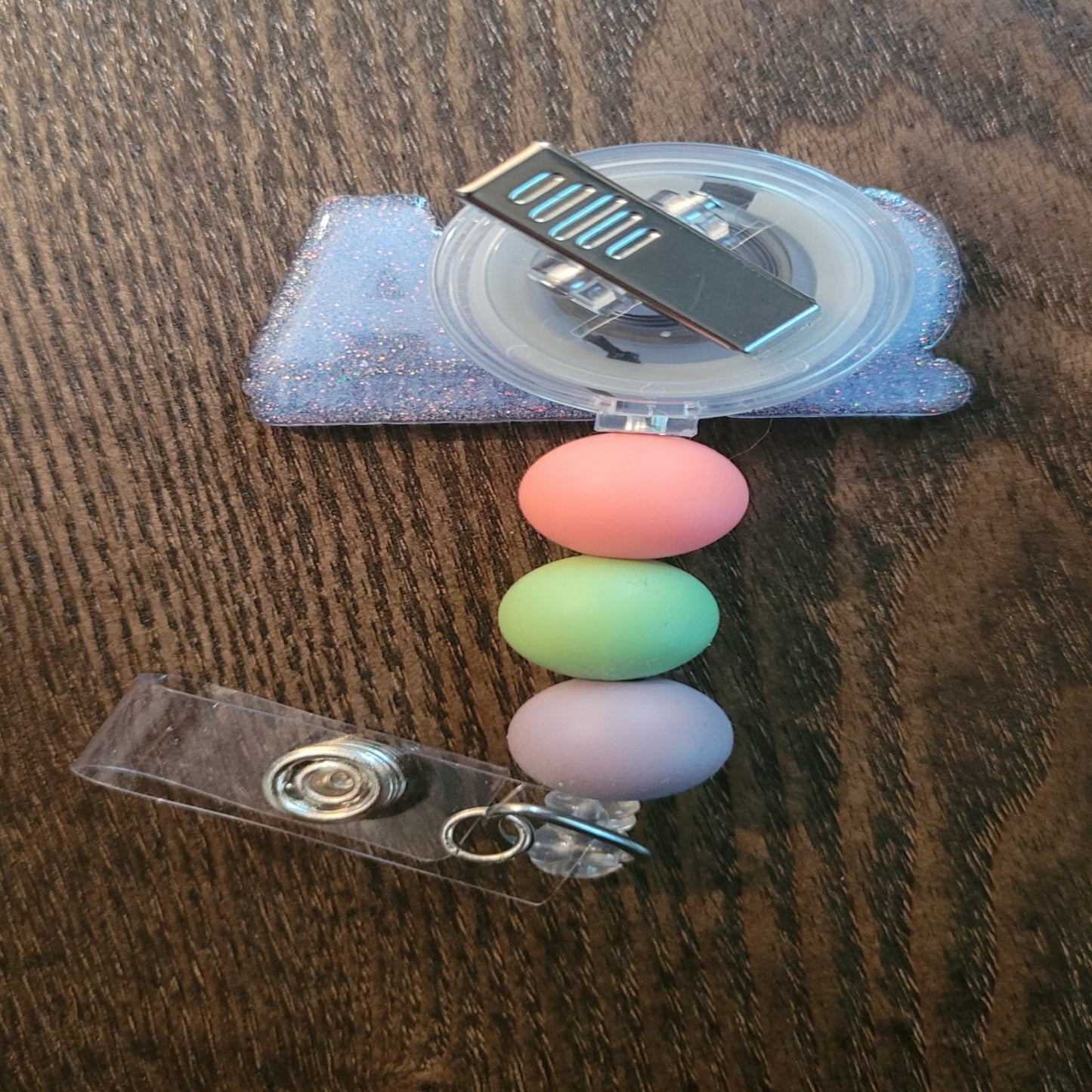 Now Part of our Medical Badge Reels collection, we have available, No not that music awards show, Certified Medical Assistant. That phrase and the letters CMA are on the front with a light blue glitter base on the back adorned with 3 coordinating silicone beads.