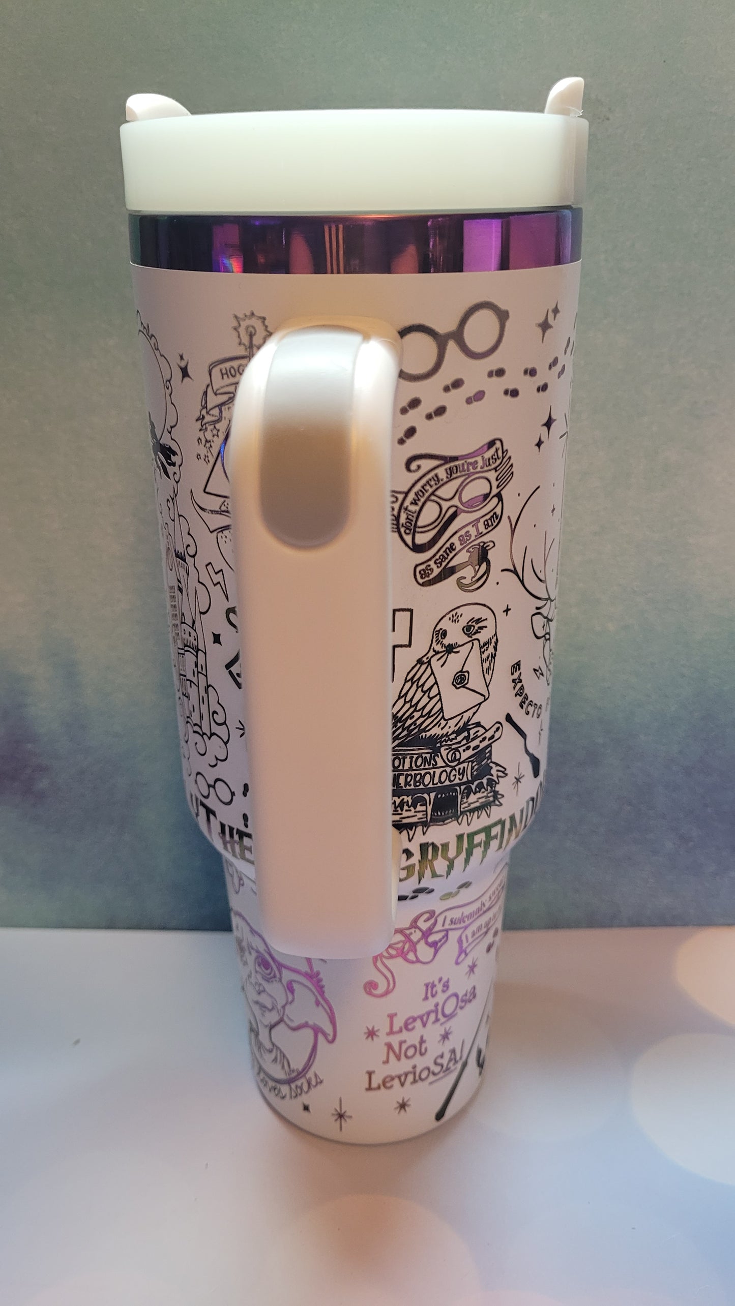 Mug with a decorative sleeve featuring text and graphics on a light background