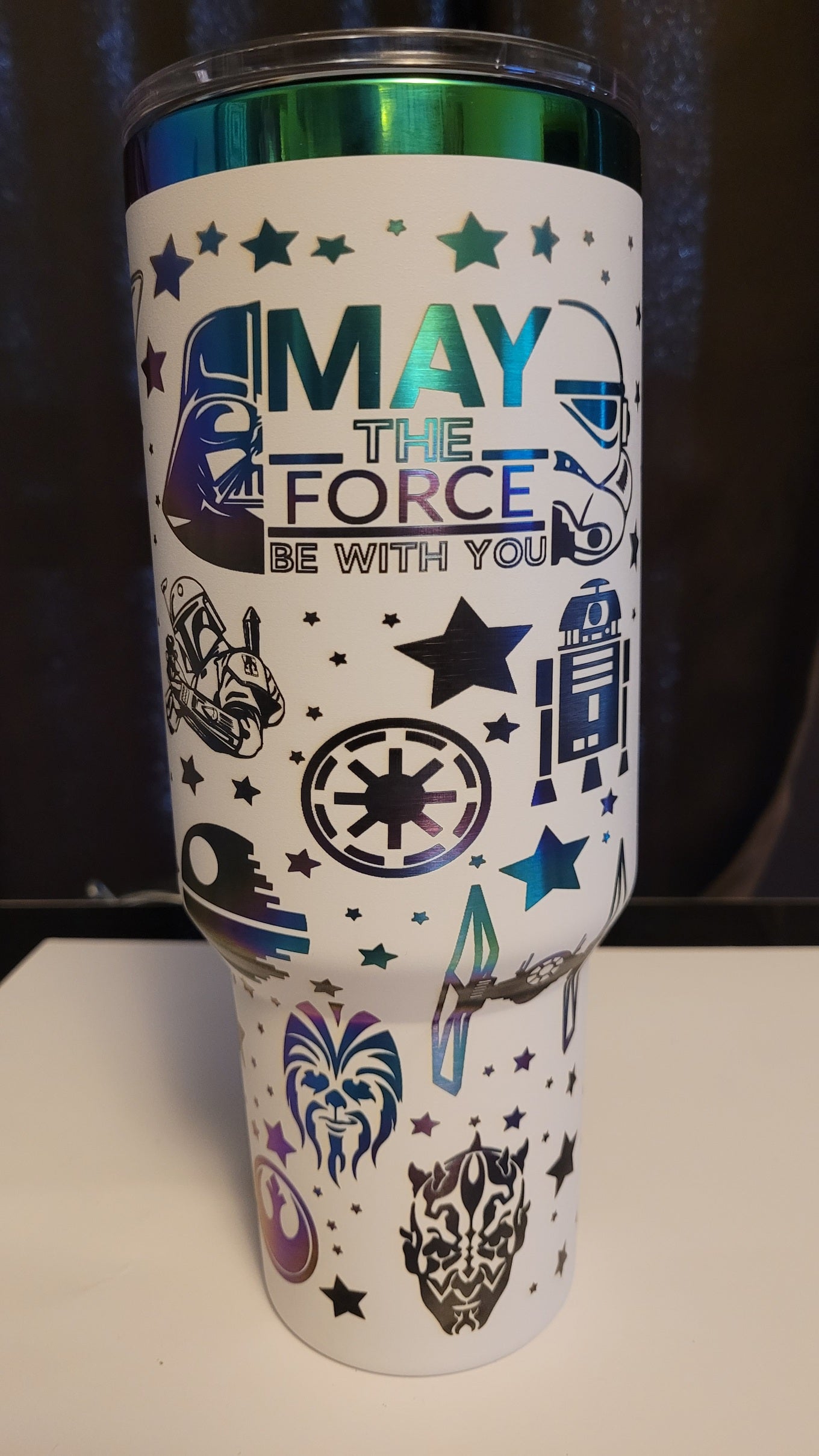 Star wars on a white 40 oz with gold plating.