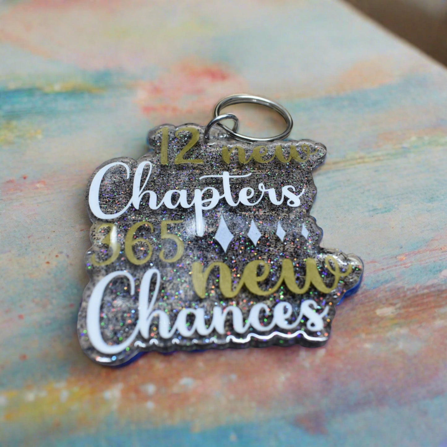 This acrylic keychain is symbolic of the 12 New Chapters and 365 New Chances that life brings, encouraging us to make every day count.