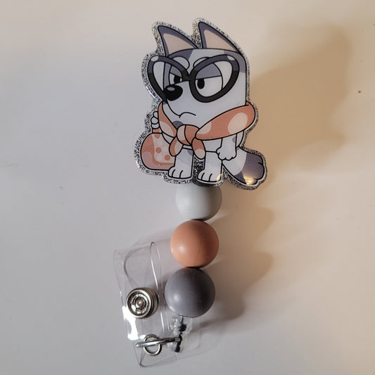 Badge holder with cartoon character design on a plain background