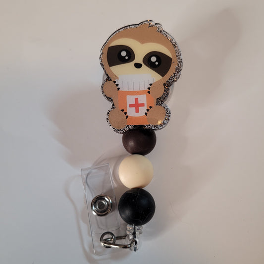 Retractable badge holder with sloth design on a white background
