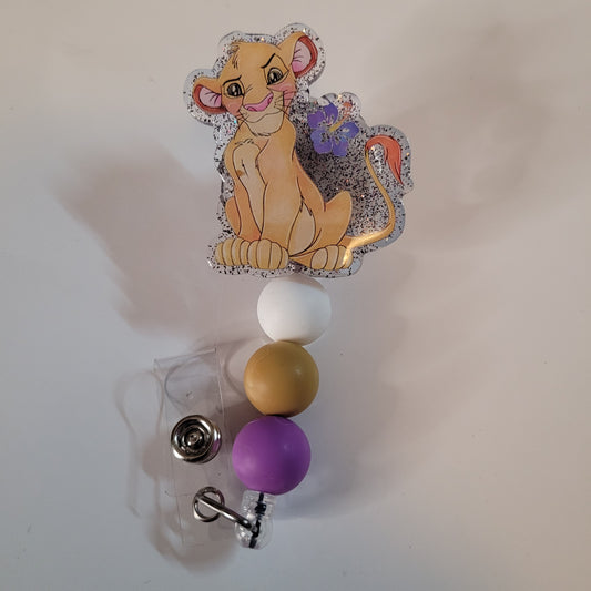 Badge holder with cartoon character and colorful beads on a white background