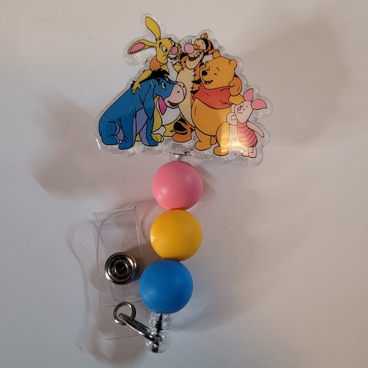 Colorful badge holder with cartoon characters on a white background