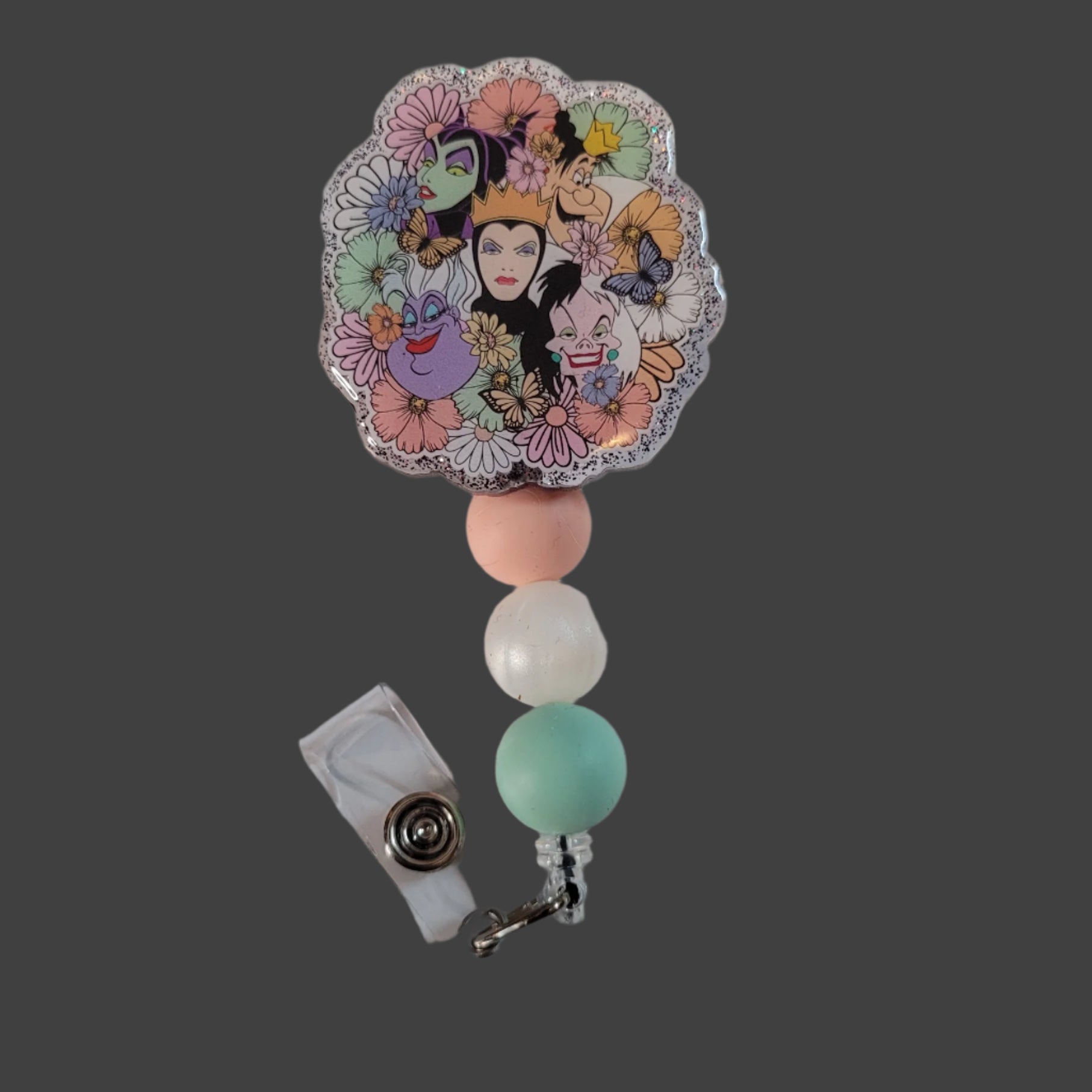 Colorful badge holder with character design on a white background