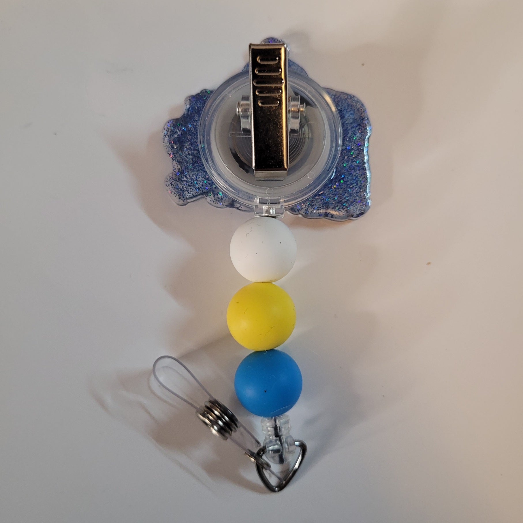 Badge holder with colorful beads on a white background
