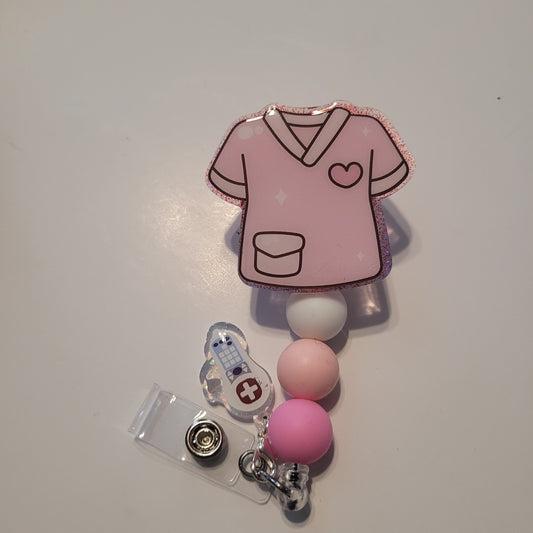 Pink badge reel with a heart design on a white background