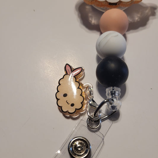 Badge holder with a cute animal charm on a white background