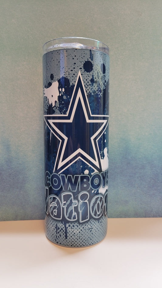 Tumbler with blue splatter design and cowboys