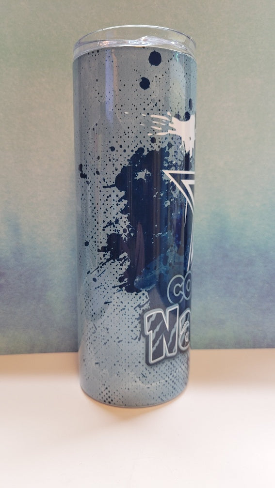 Tumbler with blue splatter design and cowboys