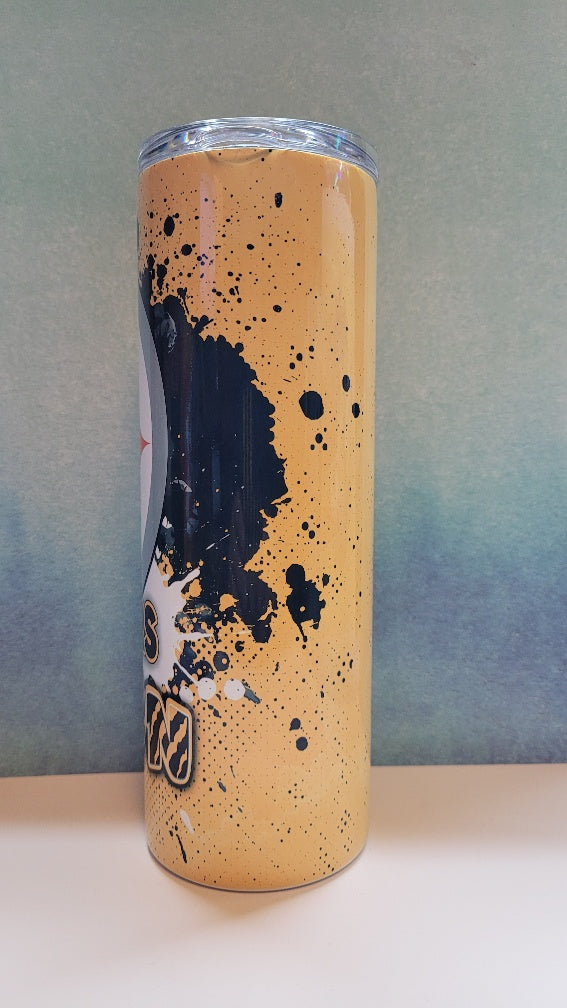 Can with orange and black splatter design on a gray background