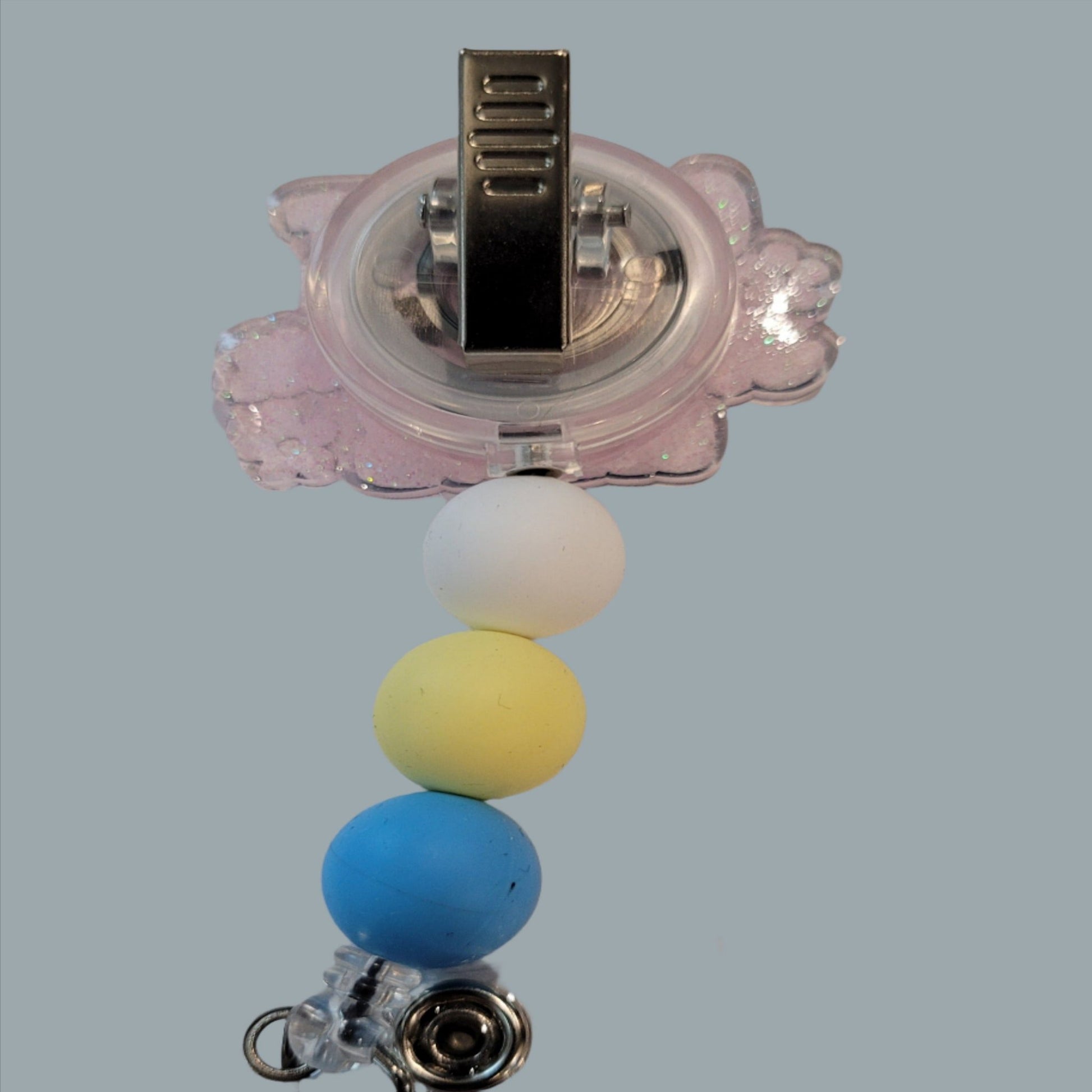 I have used this phrase as well! I Don't Know I Just Work Here. The battle cry of nearly every worker when asked about something in the work place. This acrylic Badge Reel has a light pink glitter back and 3 silicone color coordinated beads to finish the look.
