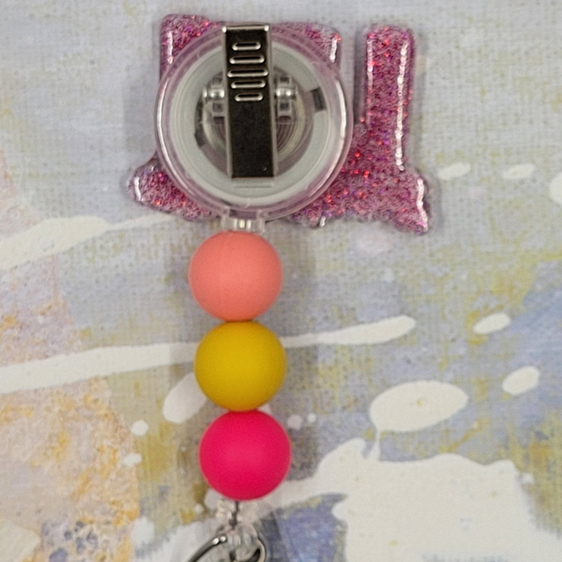 Introducing the new LPN Badge Reel, part of our latest collection of Medical Badge Reels available now. Featuring LPN in floral lettering, Licensed Practical Nurse in black script on the front. A reddish glitter base adorned with coordinating beads, this Badge Reel is sure to catch the eye.