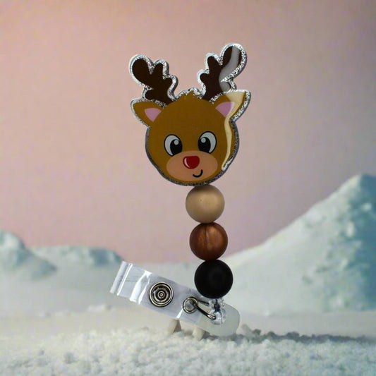 This acrylic Reindeer badge reel is the perfect way to show off your holiday spirit, featuring tan brown & black silicone accents. Get into the Christmas spirit--you can almost hear the sound of sleigh bells!