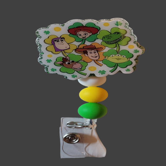Here we have a fun Rootin Tootin Friends Badge Reel featuring all your favorite character's on lucky 4 leaf clovers. A green glitter back and 3 matching silicone beads finish the look.