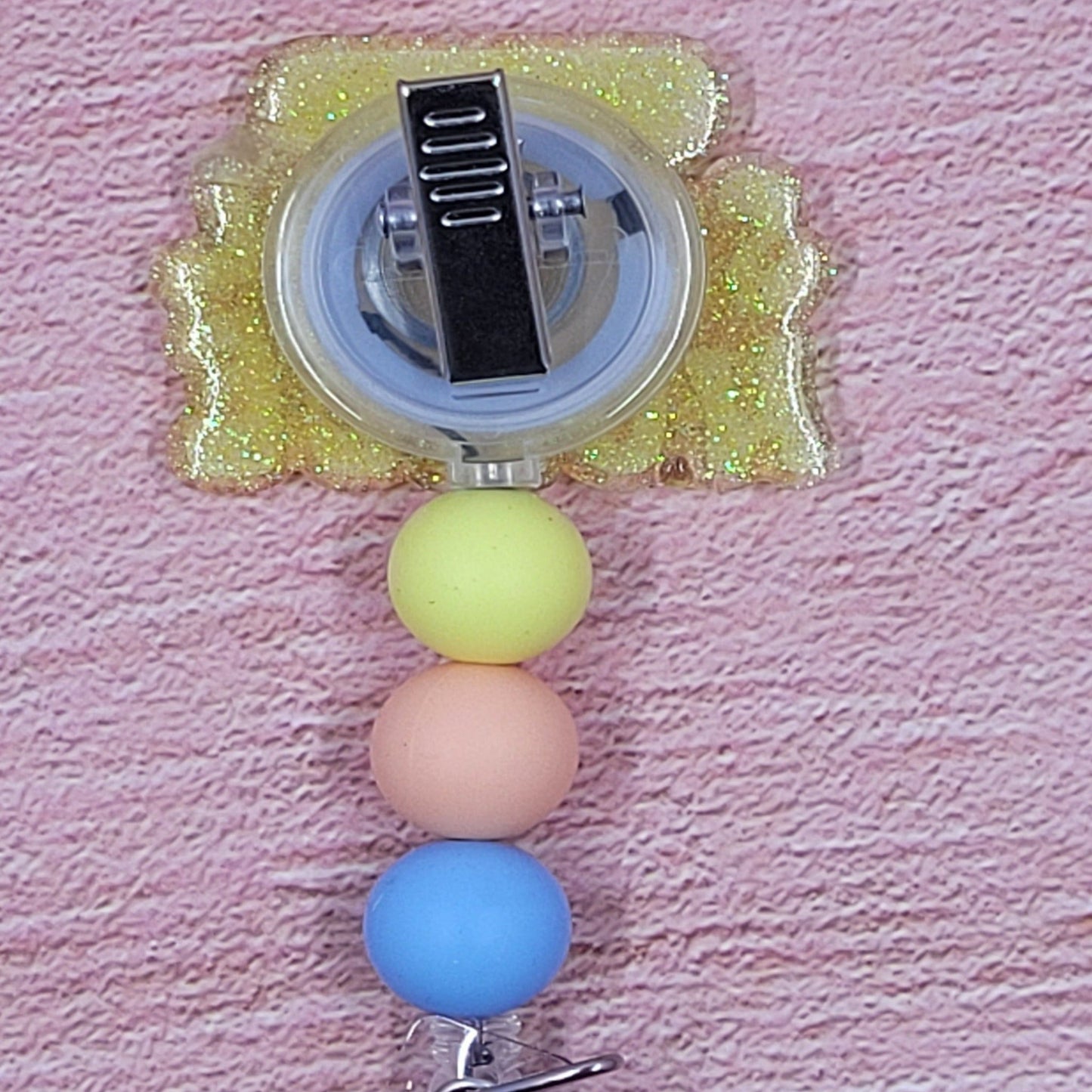 Introducing the new School Nurse Badge Reel, part of our latest collection of Medical Badge Reels available now. Featuring School Nurse with a Band-Aid and a yellow glitter base adorned with coordinating beads, this Badge Reel is sure to catch the eye.