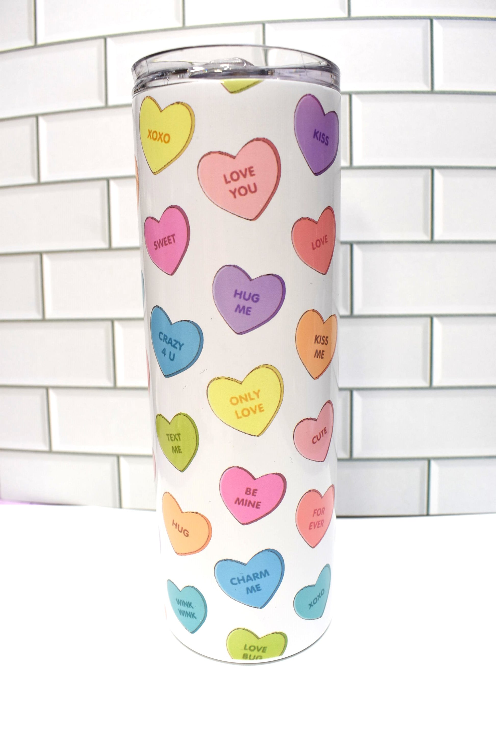 A 20 oz Makerflo Stainless Steel Tumbler with Valentines Candies offers superior insulation with a double-wall vacuum, making it a great option for keeping drinks cold for 24+ hours and warm for 8 hours. 