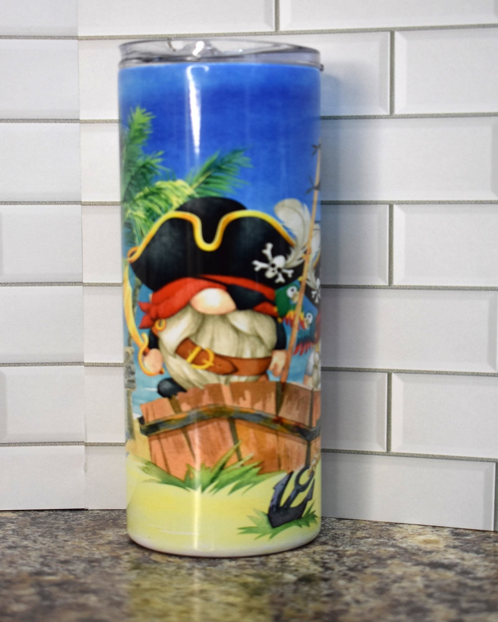 Get ready to walk the plank with these 2 cute Gnome Pirates who washed up on shore in the Caribbean to bury their treasure. This is on our 20 oz Makerflo Stainless Steel Tumbler, sure to keep the cold drinks cold or your coffee piping hot.
