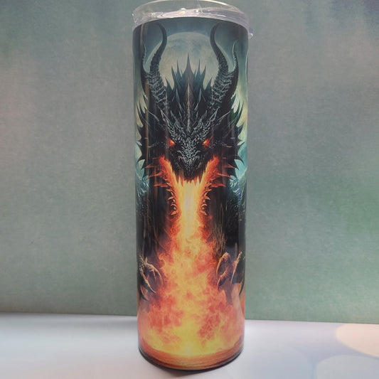 Introducing our latest addition The Dragon Series. Here Be Dragons. We call this one Night Dragon. Awesome dragon in the foreground of a full moon in a full on fire breathing moment. The colors are stunning on this tumbler. This is made from stainless steel with a double-wall construction and is vacuum insulated, with a clear sliding classic lid and a clear straw, and is BPA free. It is capable of retaining cold temperatures for 24+ hours or warm temperatures for up to 8 hours