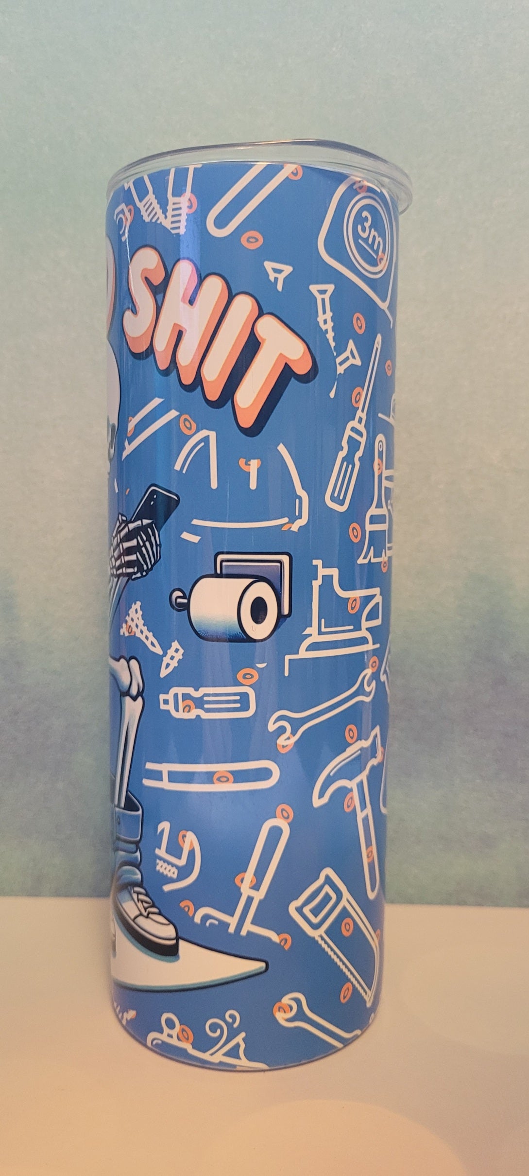 Doing Dad Shit. Just as it says. A Dad skeleton sitting on the throne will catching up on social media. A blue background with various tools a dad uses all the time fully wraps